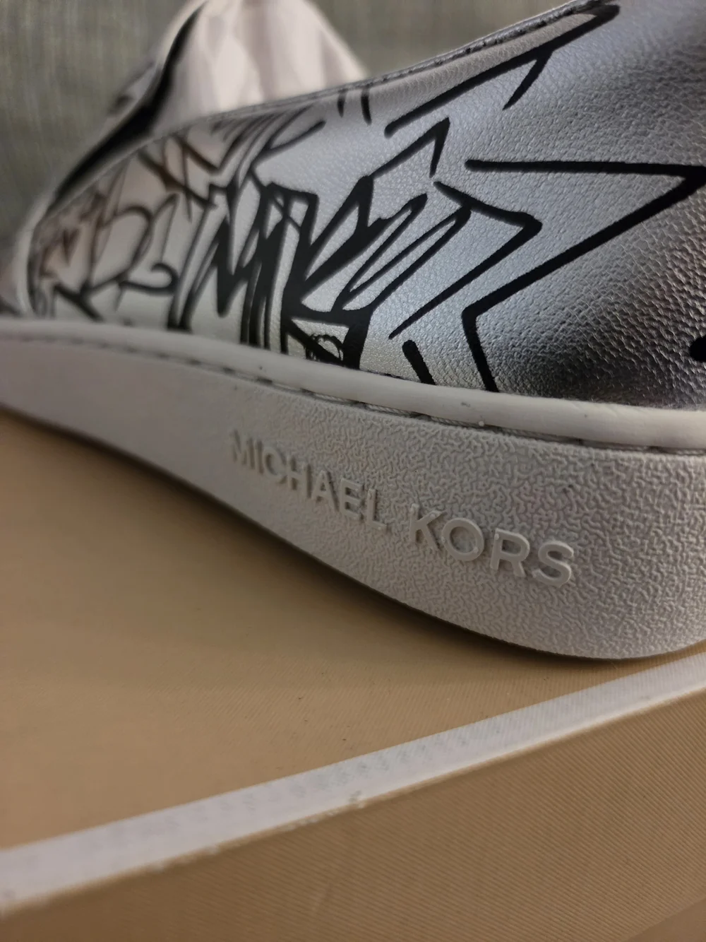Michael Kors White Slip-On Sneakers with Black Graffiti